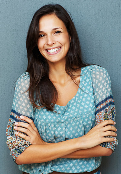 Woman with crossed arms smiling