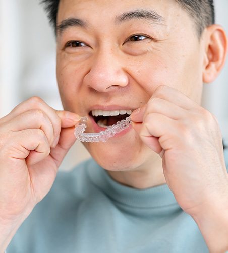 Man holding Invisalign