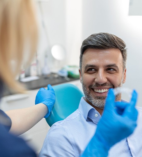 Man getting Invisalign from dentist