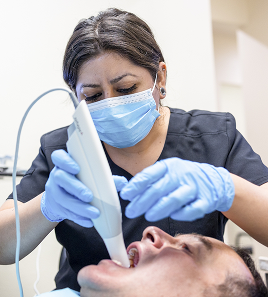 Woman in dental chair with tooth pain