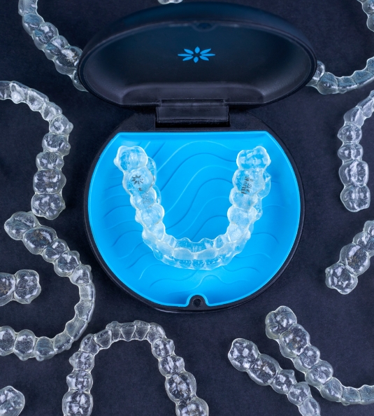 Clear aligner in case surrounded by many other aligners