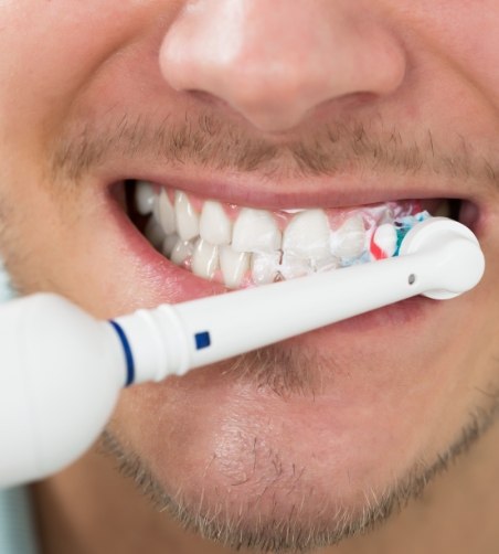 Brushing teeth with an electric toothbrush