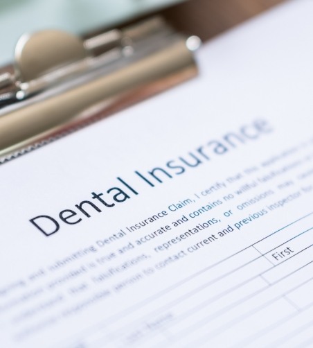 Close up of dental insurance form on clipboard