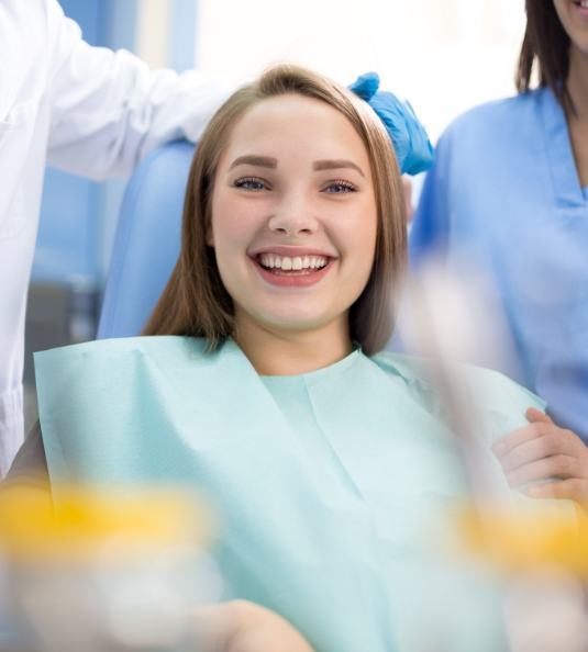 Female dental patient looking forward and smiling