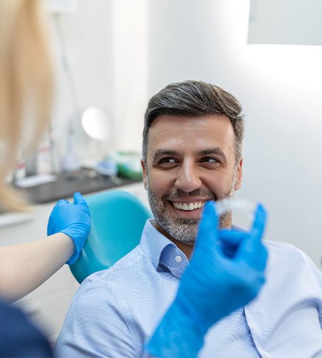 Man with Invisalign at the dentist