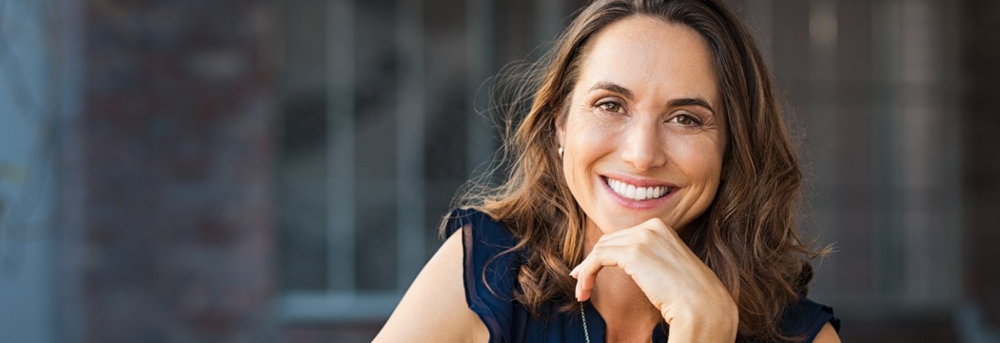 Woman leaning on hands and smiling