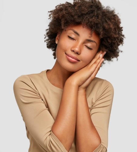 Relaxed woman resting head on her hands