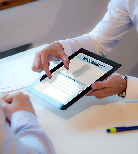 Showing patient dental insurance form on tablet