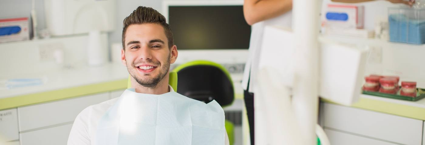 Young man sitting in dental chair